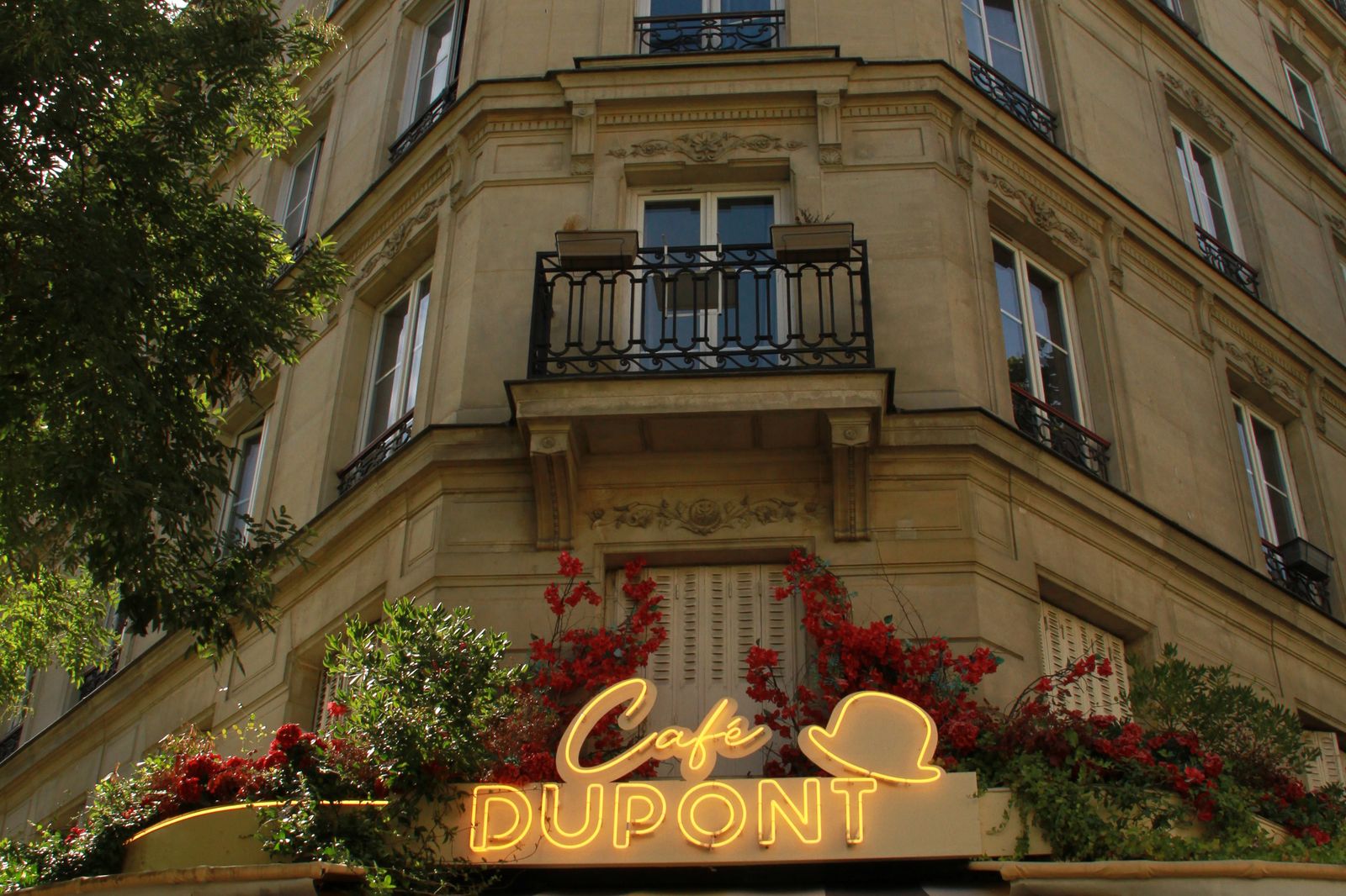 The frontage and sign of Café Dupont