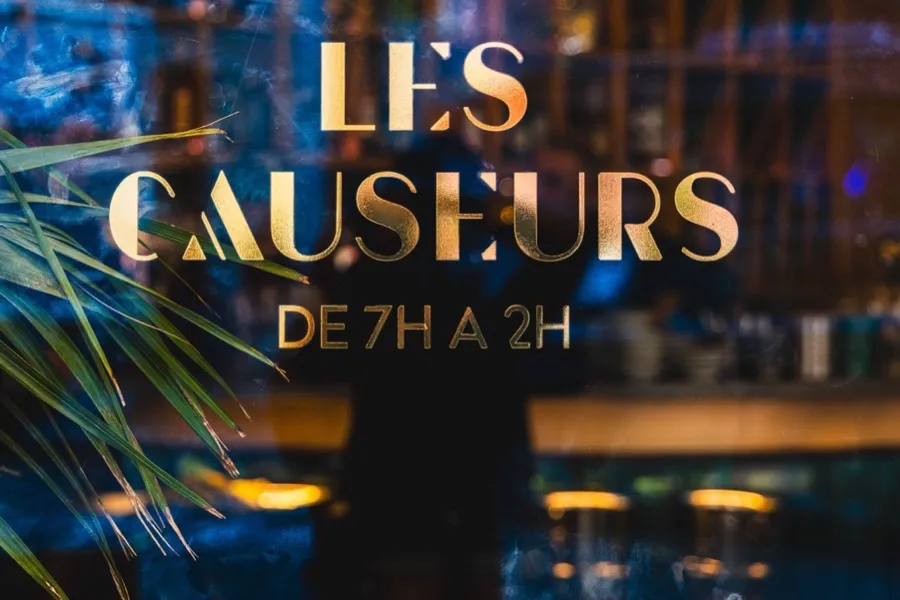 The front of Les Causeurs, gold lettering on the façade